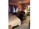 Bedroom with an office setup, providing a functional and comfortable living space at 2802 W Lawrence Rd, Phoenix, AZ 85017