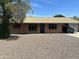 Charming brick home with well-maintained landscaping and a convenient carport at 2802 W Lawrence Rd, Phoenix, AZ 85017