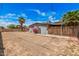 Spacious backyard featuring a palm tree, providing ample space for outdoor activities and potential landscaping at 3013 W Port Au Prince Ln, Phoenix, AZ 85053