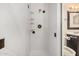 Bathroom featuring a glass shower stall, dark wood vanity, and bright white tile at 3013 W Port Au Prince Ln, Phoenix, AZ 85053