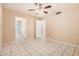 Bedroom featuring tile flooring, neutral paint, and two entryways at 3013 W Port Au Prince Ln, Phoenix, AZ 85053