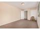 This bedroom features carpet flooring, beige walls, a closet, and a window at 3013 W Port Au Prince Ln, Phoenix, AZ 85053