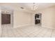 Open dining area with tile flooring, access to the kitchen, and double doors to the front entry at 3013 W Port Au Prince Ln, Phoenix, AZ 85053