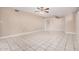 Open living area with tile floors and contemporary ceiling fan fixture at 3013 W Port Au Prince Ln, Phoenix, AZ 85053