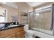 Bathroom with granite counters, a shower, and a bath featuring sliding glass doors at 3021 S Evergreen Rd, Tempe, AZ 85282