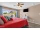 Bright bedroom with a ceiling fan and sliding glass door leading to the pool at 3021 S Evergreen Rd, Tempe, AZ 85282