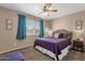 A calming bedroom with a ceiling fan and a queen size bed at 3021 S Evergreen Rd, Tempe, AZ 85282