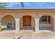 Welcoming front entrance with covered arched walkway, natural lighting, and desert landscaping at 3021 S Evergreen Rd, Tempe, AZ 85282