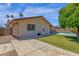 Exterior view of home and backyard pool with covered patio at 3021 S Evergreen Rd, Tempe, AZ 85282