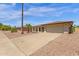 Spacious home boasting mature landscaping, desert landscaping, and a wide driveway at 3021 S Evergreen Rd, Tempe, AZ 85282