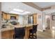 Updated kitchen with granite countertops, stainless appliances, and breakfast bar seating at 3021 S Evergreen Rd, Tempe, AZ 85282