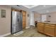 Kitchen with stainless steel refrigerator, wood cabinets, and breakfast nook at 3021 S Evergreen Rd, Tempe, AZ 85282