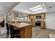 Bright kitchen with granite countertops, wood cabinets, and stainless steel appliances at 3021 S Evergreen Rd, Tempe, AZ 85282