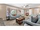 Relaxing living room with comfortable sofas, neutral tones, and plenty of natural light at 3021 S Evergreen Rd, Tempe, AZ 85282