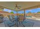 Outdoor pool area with covered patio and dining set, perfect for entertaining at 3021 S Evergreen Rd, Tempe, AZ 85282