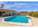 A beautiful backyard pool with surrounding concrete, complemented by a covered patio at 3021 S Evergreen Rd, Tempe, AZ 85282