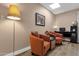 Comfortable seating area with chairs, a lamp, and an art piece at 3021 S Evergreen Rd, Tempe, AZ 85282