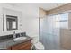Bathroom with a vanity with a dark countertop and glass enclosed shower at 3233 N 37Th St # 5, Phoenix, AZ 85018