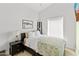A cozy bedroom features a queen-sized bed, a window with blinds, and ample closet space at 3233 N 37Th St # 5, Phoenix, AZ 85018