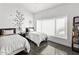 Bright bedroom featuring two beds, stylish decor, and a large window at 3233 N 37Th St # 5, Phoenix, AZ 85018