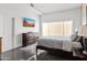 Bright bedroom with a comfortable bed, dresser, and large window offering plenty of natural light at 3233 N 37Th St # 5, Phoenix, AZ 85018