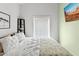Inviting bedroom featuring a comfortable bed with decorative pillows and a window at 3233 N 37Th St # 5, Phoenix, AZ 85018