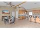 Bright dining area featuring a wood dining table, high ceilings, and an open layout connecting to the kitchen at 3233 N 37Th St # 5, Phoenix, AZ 85018