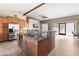 Expansive kitchen island with granite countertop and stainless steel appliances, open to the living area at 3233 N 37Th St # 5, Phoenix, AZ 85018