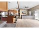 Open concept living room area with a granite kitchen bar, stainless steel appliances, and tile floors at 3233 N 37Th St # 5, Phoenix, AZ 85018