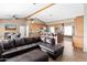 Inviting living room with a plush leather sectional sofa, leading to a kitchen area with a breakfast bar at 3233 N 37Th St # 5, Phoenix, AZ 85018