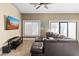 Cozy living room with ceiling fan, comfortable seating and a large window providing natural light at 3233 N 37Th St # 5, Phoenix, AZ 85018