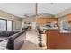 An open concept living room, dining area, and kitchen featuring an eat in bar and neutral color palette at 3233 N 37Th St # 5, Phoenix, AZ 85018