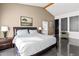 Comfortable main bedroom with a king size bed, accent chair, and modern decor at 3233 N 37Th St # 5, Phoenix, AZ 85018