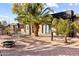 Outdoor patio with a fire pit, table with chairs, and large palm trees for privacy at 3233 N 37Th St # 5, Phoenix, AZ 85018