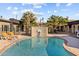 Community swimming pool area with lounge chairs and desert landscaping at 3233 N 37Th St # 5, Phoenix, AZ 85018