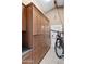 Garage with bike, ample storage cabinetry, granite counters, and access door at 3233 N 37Th St # 5, Phoenix, AZ 85018