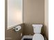 Powder room displaying a standard toilet next to a frosted window at 3233 N 37Th St # 5, Phoenix, AZ 85018