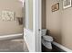 Half bathroom with unique art, granite counter, and tile flooring at 3233 N 37Th St # 5, Phoenix, AZ 85018