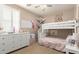 bedroom featuring a bunk bed, dresser, decor and neutral walls and carpet at 3308 E Jasper Dr, Gilbert, AZ 85296