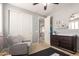Cozy bedroom with a gray armchair, toddler bed, and easy access to closet at 3308 E Jasper Dr, Gilbert, AZ 85296