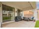Outdoor living space offering seating and a grill for entertaining under a covered patio at 3308 E Jasper Dr, Gilbert, AZ 85296