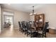 Traditional dining room with a large wood table, chairs, and a display cabinet at 3308 E Jasper Dr, Gilbert, AZ 85296
