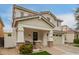 Charming two-story home featuring a covered porch, a two car garage and a landscaped front yard at 3308 E Jasper Dr, Gilbert, AZ 85296