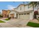 Charming two-story home featuring a covered porch, a two car garage and a landscaped front yard at 3308 E Jasper Dr, Gilbert, AZ 85296