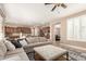 Open concept living space with a large sectional sofa and view to the dining and kitchen areas at 3308 E Jasper Dr, Gilbert, AZ 85296
