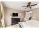 Spacious main bedroom with ceiling fan, dresser, and a doorway that leads to another room at 3308 E Jasper Dr, Gilbert, AZ 85296