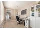 Bright office area with built-in shelving, drawers and natural light, ideal for remote work at 3308 E Jasper Dr, Gilbert, AZ 85296