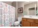 Bathroom with a shower/tub combo, a single sink vanity, and light wood cabinetry at 343 W Twin Peaks Pkwy, San Tan Valley, AZ 85143