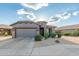 Charming single-story home with a two-car garage, desert landscaping, and well-manicured lawn at 343 W Twin Peaks Pkwy, San Tan Valley, AZ 85143