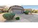 Attractive home with a two-car garage and desert landscaping at 343 W Twin Peaks Pkwy, San Tan Valley, AZ 85143